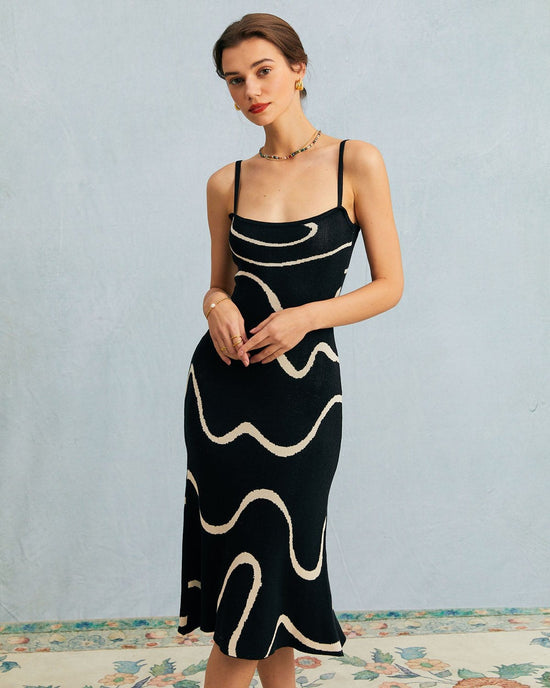 Vestido midi negro de punto con dobladillo en onda y silueta de sirena